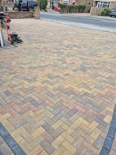 Multi-colour brick paving with black border